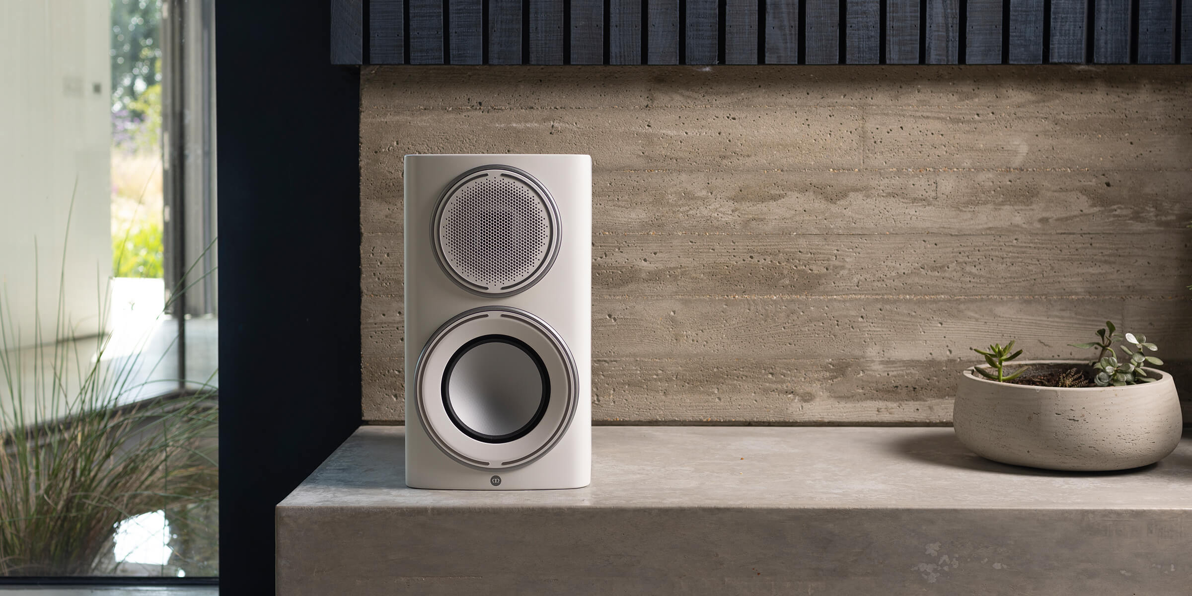 Monitor Audio's Platinum 100 3G, lifestyle, in a Pure Satin White finish.
